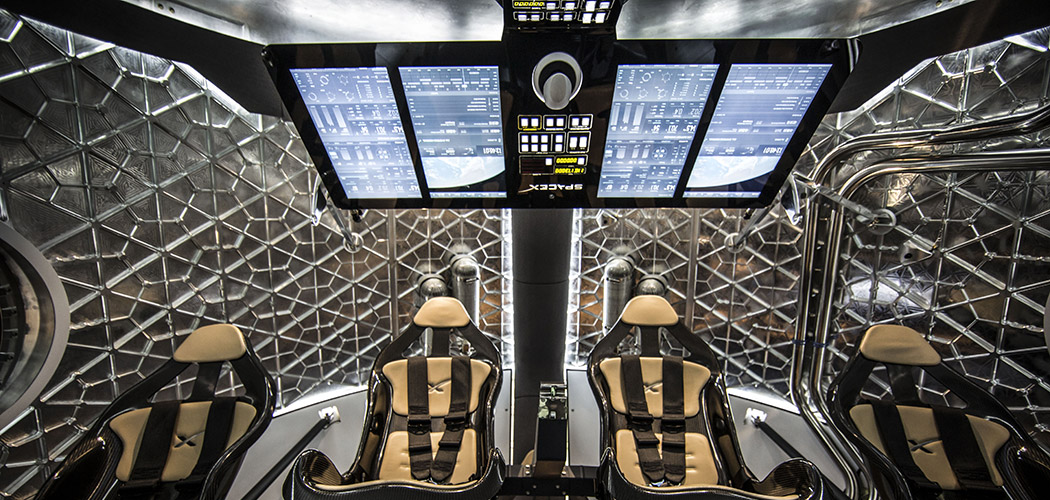 Dragon interior crew area with seats and control screens